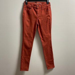 Stretchy mid rise burnt orange skinny jeans